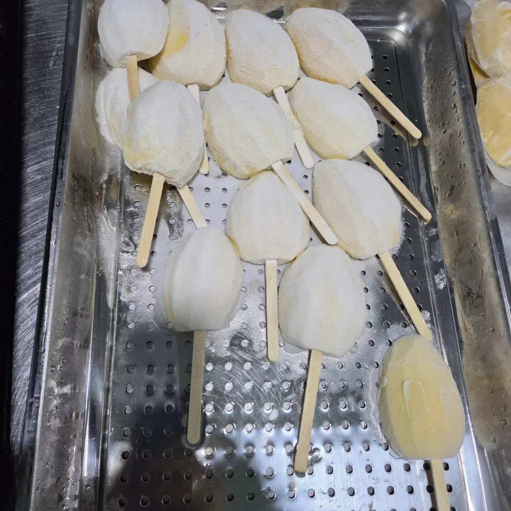 Vietnamese peeled mango on sticks prepared for freezing – HAVIGO